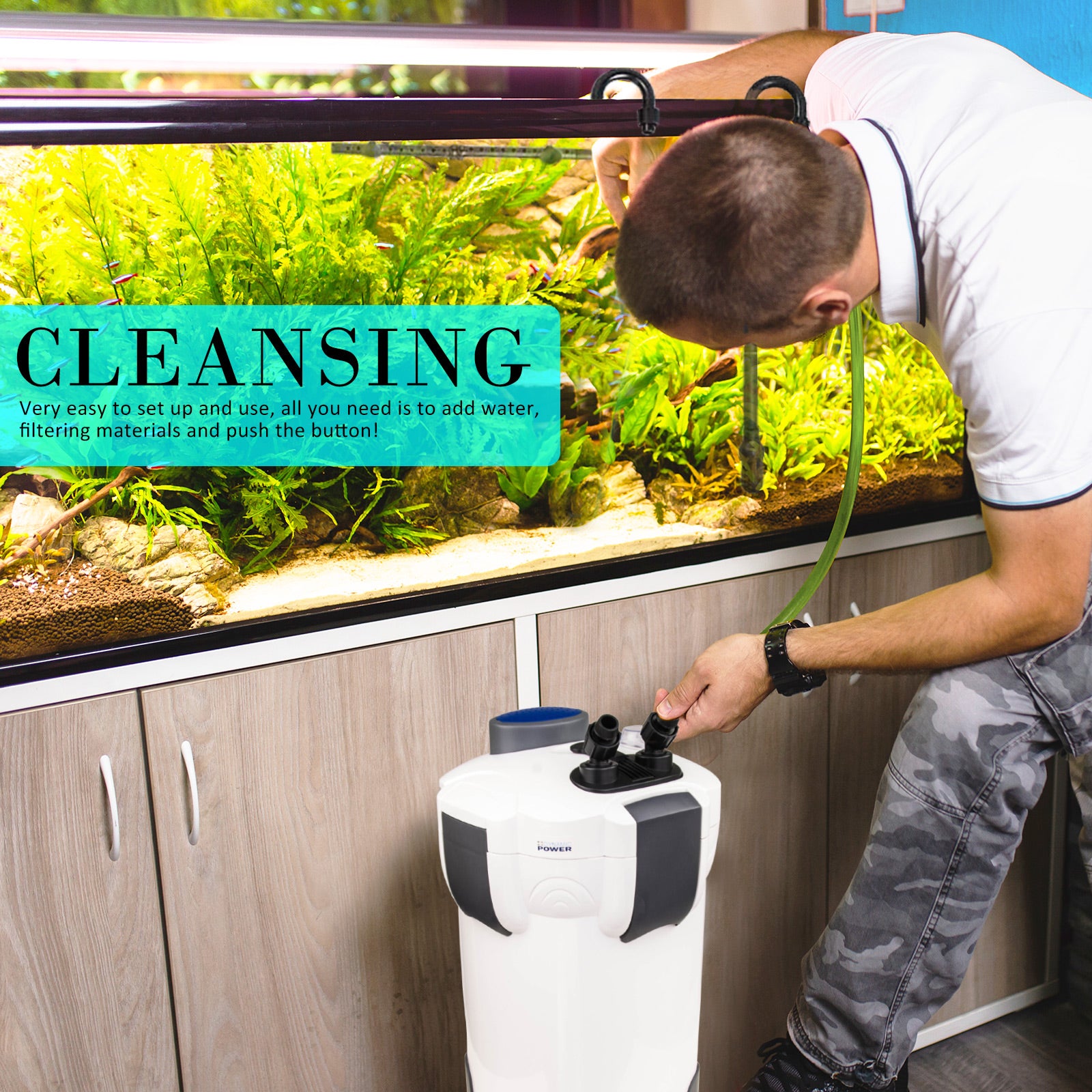 Person setting up an aquarium with the Dynamic Power  aquarium canister filter, text indicating 'Cleansing' and ease of use.