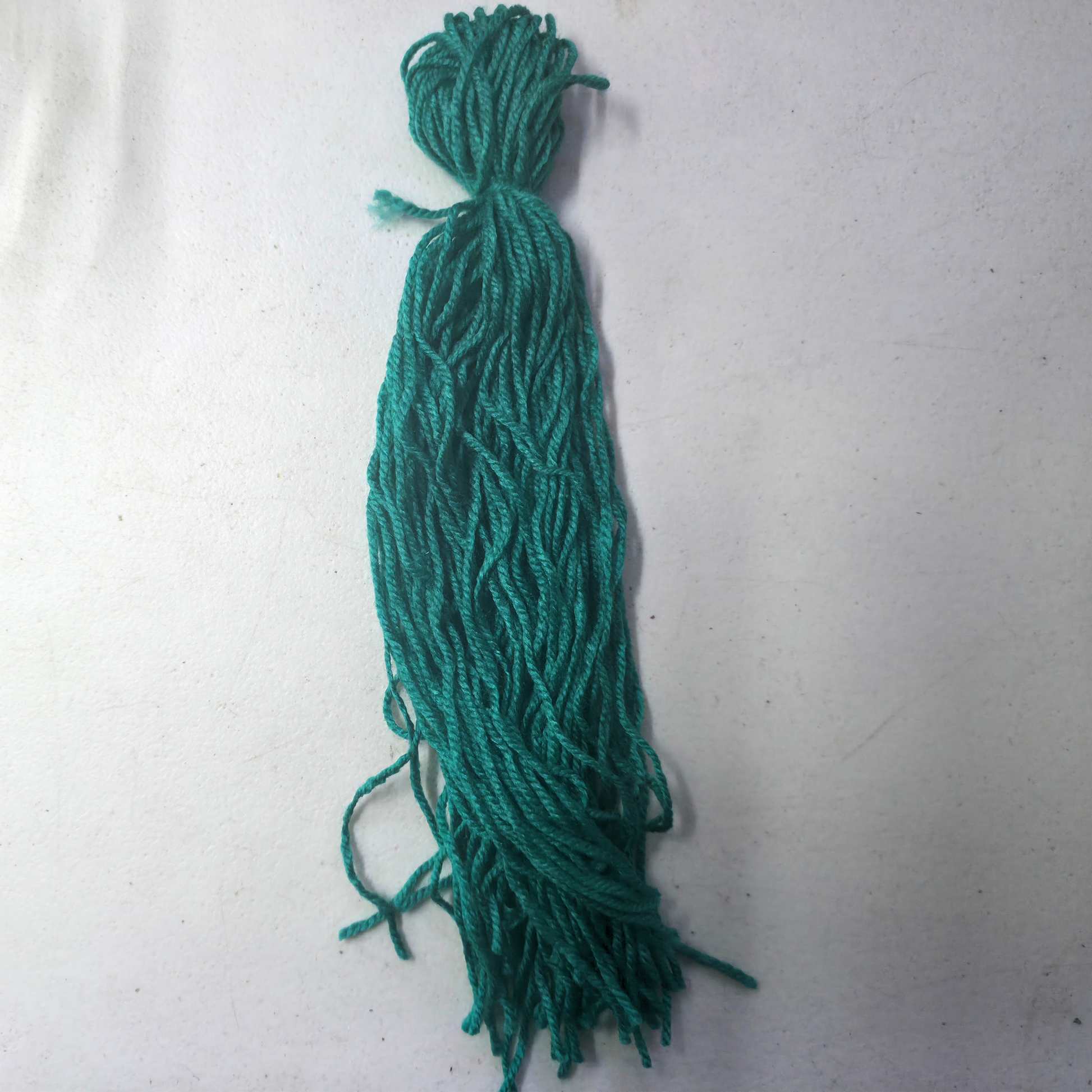 Green Spawn mop for fish breeding on a white background