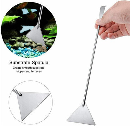Metal substrate spatula being used on aquarium substrate with close-up inset.